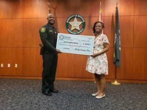 Our Community Grows: Broward Sheriff Gregory Tony Awards Be Strong International $9,750